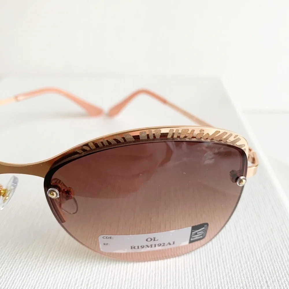 NWT pink and rose gold semi rimless sunglasses